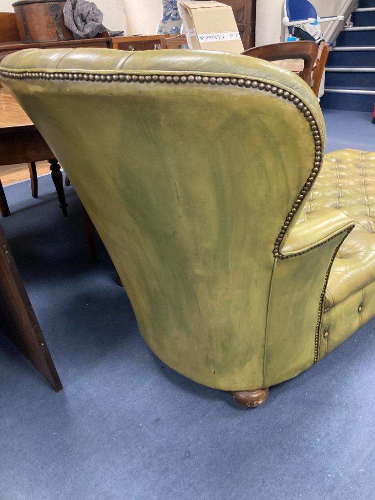 A Victorian style daybed upholstered in buttoned green leather, length 170cm, width 70cm, height 82cm